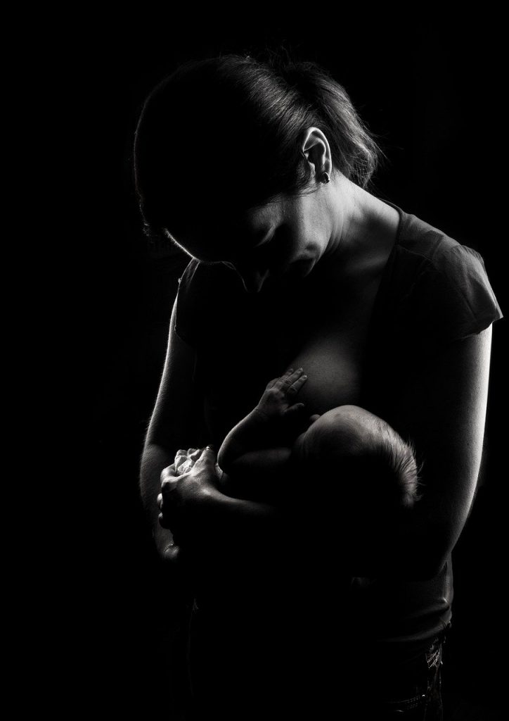 Mother calmly breastfeeding her baby